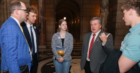 Sen. Stan Clouse of Kearney, second from right, meets with UNK students Wednesday during the annual “I Love NU” Day event at the State Capitol in Lincoln. (Photo by Erika Pritchard, UNK Communications)