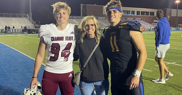 Shay and Trey Prichard are pictured with their mother Nicole after last year’s UNK-Chadron State football game in Kearney. (Courtesy photo)