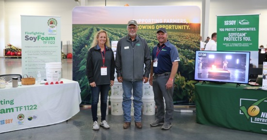 Nebraska State Fire School 1: Maria and Dave Garlie of Cross Plains Solutions with United Soybean Board Director Greg Greving (middle) at the Nebraska State Fire School expo in Grand Island.