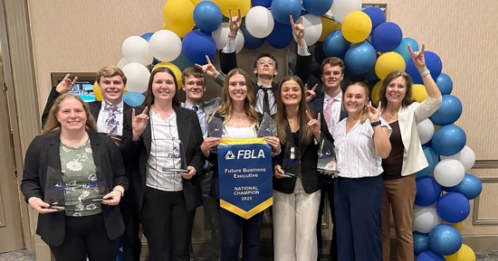 Nine UNK students recently competed at the FBLA Collegiate National Leadership Conference in Dallas, Texas. They’re pictured with adviser Theresa Yaw, a lecturer in the UNK College of Business and Technology. (Courtesy photo)