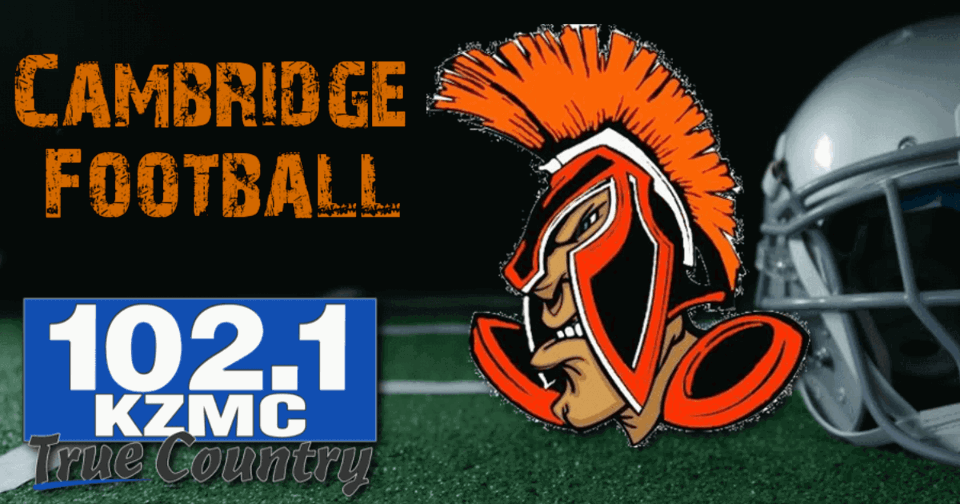 Football field in the background with the Cambridge Mascot on the right, the words Cambridge football on the upper left corner and the KZMC-FM 102.1 logo on the bottom right.